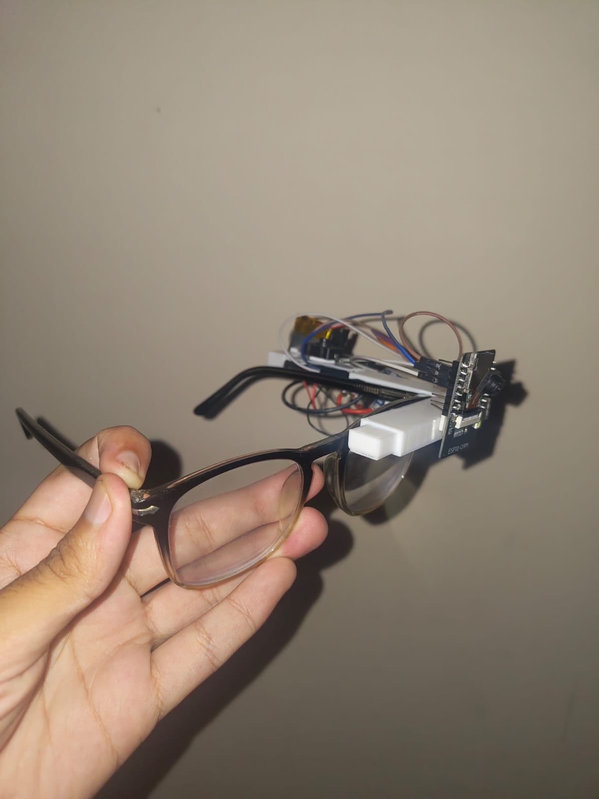 DrishtiLabs Prototype v2 — glasses frame with ESP32, OV2640 camera and wires, built in Kathmandu